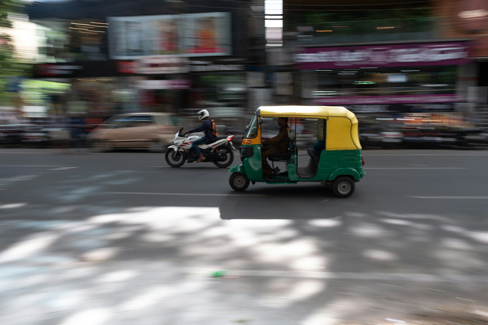 Auto-rickshaw moving through a Bengaluru street