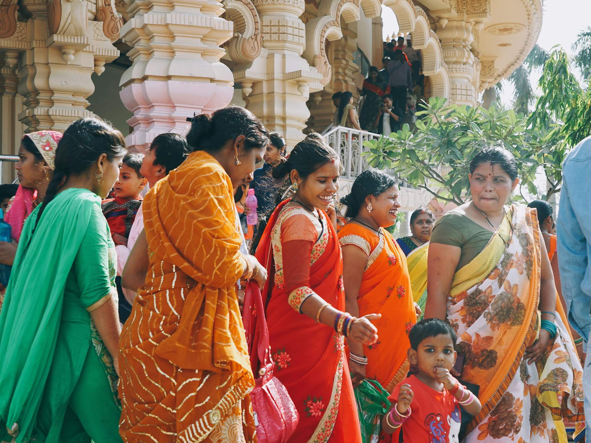 Women in colourful saris at a community gathering