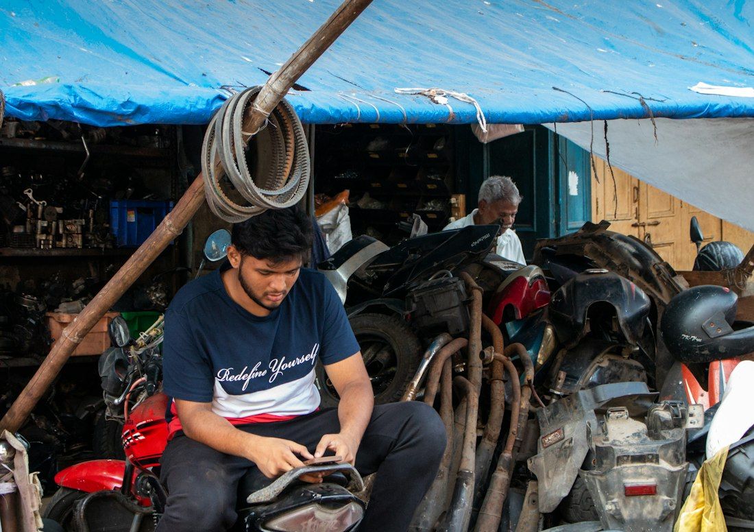 Young mechanic at a two-wheeler workshop