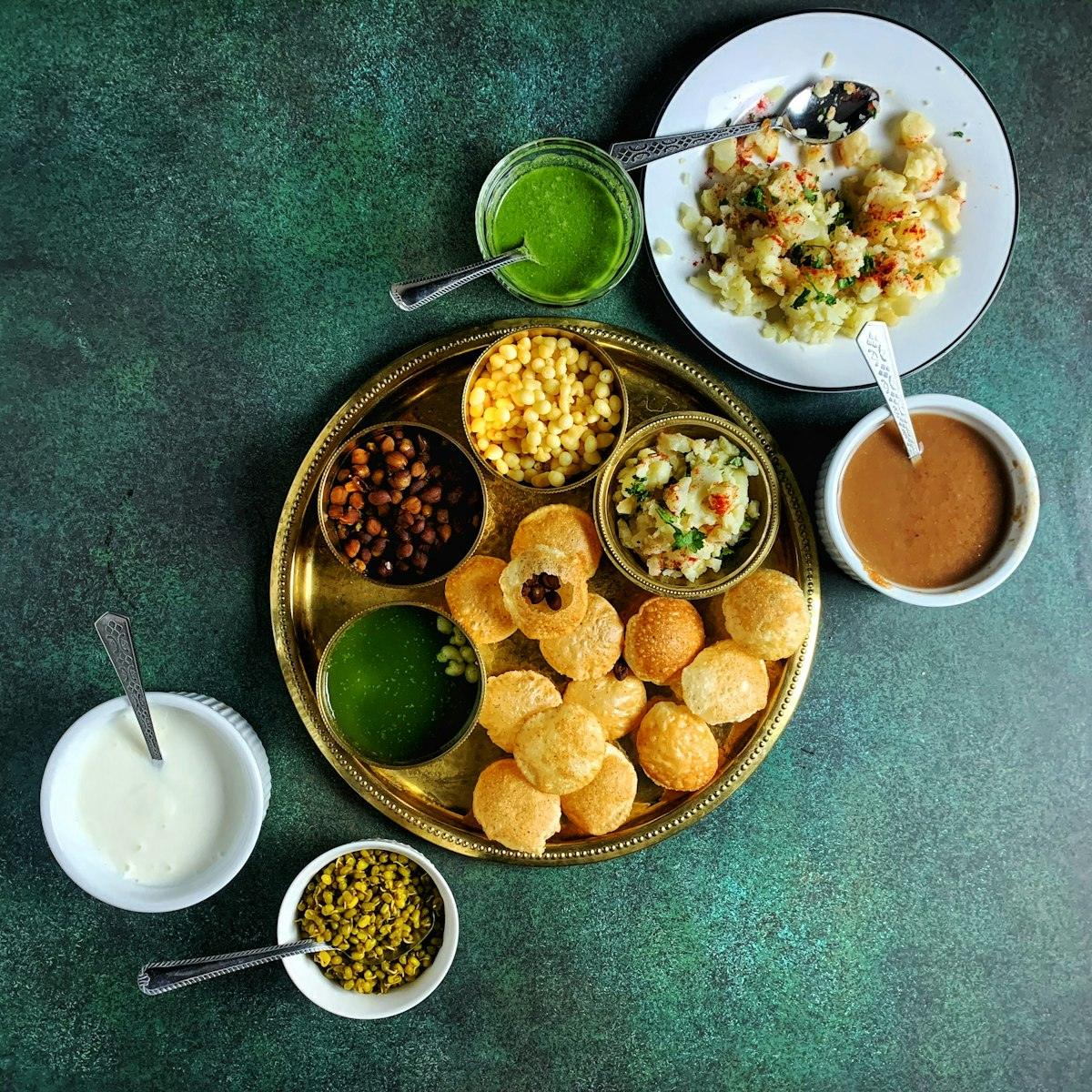 Chaat platter with pani puri and chutneys